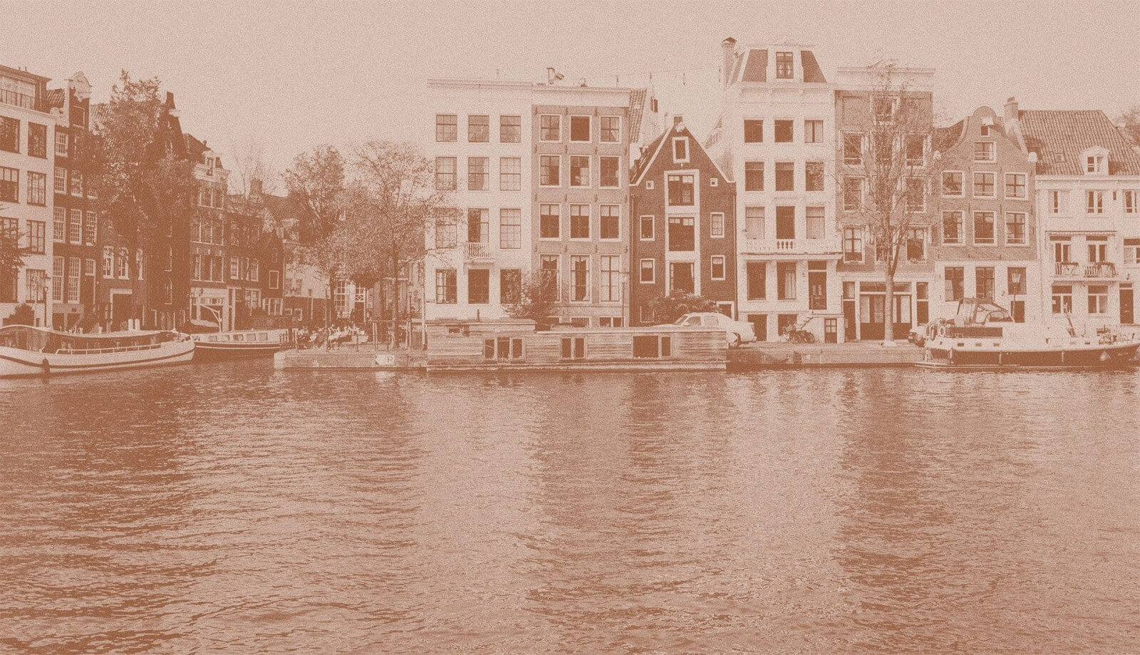 a row of buildings next to a body of water